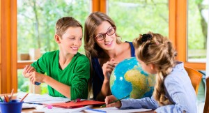 45394031 - homeschooling mother teaching kids private lessons in geography